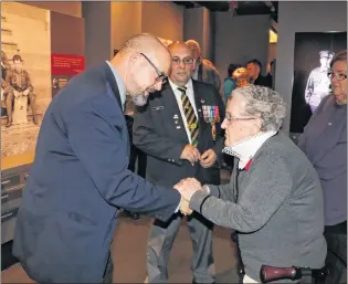  ?? GLEN WHIFFEN/THE TELEGRAM ?? George Ricketts, grandson of Sgt. Tommy Ricketts, meets Joan Ryan, daughter of Lance Cpl. Matthew Brazil for the first time at The Rooms in St. John’s in October. The First World War is still having an impact on families directly affected by the war.