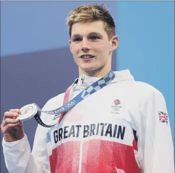  ?? Picture: Maddie Meyer/Getty Images ?? TOKYO STAR Team GB swimmer Duncan Scott proudly displays his silver during the men’s 200m individual medley medal ceremony at the 2020 Olympic Games