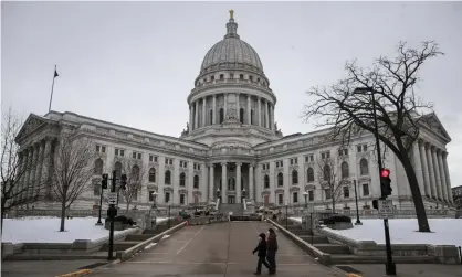  ??  ?? The Wisconsin state capitol in Madison. The American Rescue Plan contained payments to those in prison. However, prepaid debit cards used to disseminat­e the money cannot be used in prison. Photograph: Tannen Maury/EPA