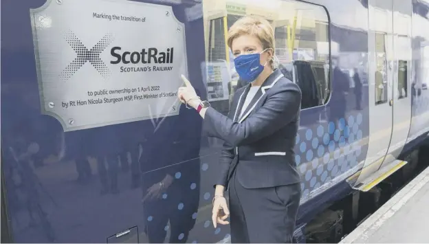  ?? ?? Nicola Sturgeon unveils a specially branded train at Glasgow Queen Street Station as Scotrail transfers from Dutch firm Abellio into public ownership