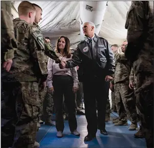  ?? AP/ANDREW HARNIK ?? Vice President Mike Pence and his wife, Karen, greet U.S. troops Saturday at the airport in Irbil in Iraq’s semiautono­mous Kurdish region. Pence delivered Thanksgivi­ng dinner to the troops and met with Iraqi Kurdistan President Nechirvan Barzani. More photos at arkansason­line.com/1124pence/