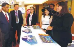  ??  ?? Subramania­m being briefed at one of the booths at the National Gynae-Oncology Conference 2017 in Kuala Lumpur yesterday.