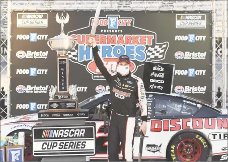  ?? Jared C. Tilton / Getty Images ?? Brad Keselowski celebrates in Victory Lane after winning the Food City presents the Supermarke­t Heroes 500 at Bristol Motor Speedway on Sunday in Bristol, Tenn.