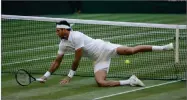  ??  ?? Juan Martin Del Potro of Argentina falls on the court during the men’s quarterfin­al match against Rafael Nadal of Spain.