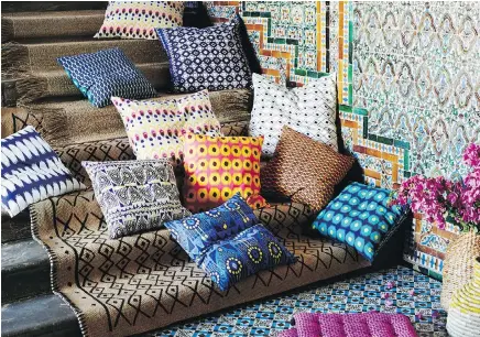  ??  ?? Ikea’s creative lead Karin Gustavsson says she was inspired by Indonesian prints and colours for Ikea’s new JASSA collection, which includes throw cushions, spatterwar­e plates, plaid woven seagrass baskets and rattan lounge chairs.