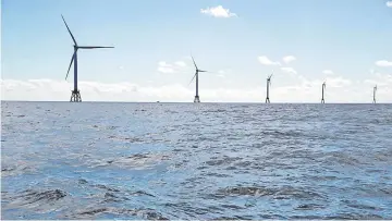  ??  ?? The GE-Alstom Block Island Wind Farm stands in the water off Block Island, Rhode Island, on Sept, 14, 2016.— WP-Bloomberg photo