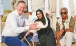  ??  ?? Officials releasing a flamingo at Al Wathba Wetland Reserve yesterday.