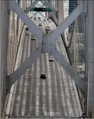  ?? RAY CHAVEZ — STAFF ARCHIVES ?? Afternoon rush-hour traffic moves on the Bay Bridge, seen from Treasure Island, in San Francisco on March 24.