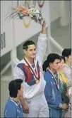  ?? Jim Gerberich Associated Press ?? GREG LOUGANIS wins the gold in springboar­d diving at the 1988 Olympics, a day after hitting his head on the board.