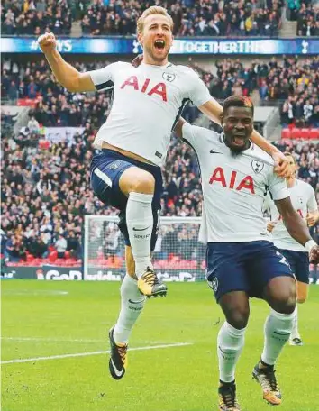  ?? AP ?? Tottenham’s Harry Kane celebrates after scoring his side’s first goal during the Premier League match against Liverpool at Wembley Stadium in London yesterday.