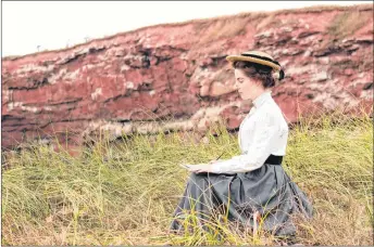  ?? SALTWIRE NETWORK PHOTO ?? Meghan Greeley as Lucy Maud Montgomery sits atop a P.E.I. red sandstone cliff during the filming of the newest Heritage Minute.