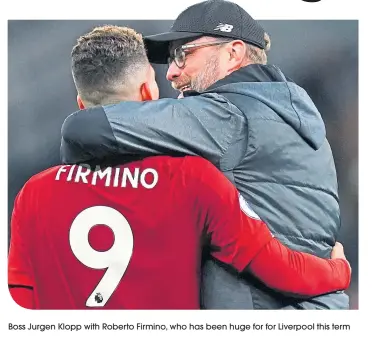  ??  ?? Boss Jurgen Klopp with Roberto Firmino, who has been huge for for Liverpool this term