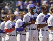  ?? THE ASSOCIATED PRESS ?? New York Mets relief pitcher Miguel Castro, center, stands for pre-game ceremonies before a home opening baseball game against the Miami Marlins, Thursday, April 8, 2021, in New York.