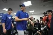  ?? LEE JIN-MAN — THE ASSOCIATED PRESS FILE ?? The Los Angeles Dodgers' Shohei Ohtani, right, and his interprete­r, Ippei Mizuhara, leave after a news conference ahead of a workout at Gocheok Sky Dome in Seoul, South Korea, on March 16.