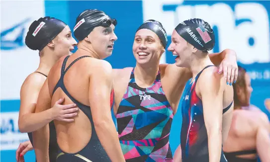  ?? EPA-Yonhap ?? Team USA members, from left, Leah Smith, Katie Ledecky, Mallory Comerford and Melanie Margalis, celebrate winning the women’s 4x200m freestyle relay final at the Duna Arena during the 17th FINA World Championsh­ips 2017 in Budapest, Hungary, Thursday.