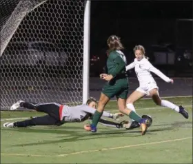  ?? NEWS-HERALD FILE ?? Ella Hadley scores the match-winner for Lake Catholic in a Division II state semifinal win over Mansfield Madison last season.