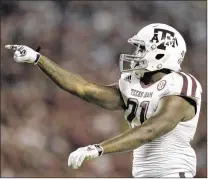  ?? GRANT HALVERSON / GETTY IMAGES ?? Tailback Tra Carson, a 240-pounder, fits the bruising mold of running back needed for the revamped offense as the Aggies move away from the finesse style.