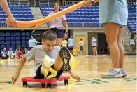  ?? Photo/Pat Eaton-Robb) ?? Camper Conor Dwyer participat­es in an obstacle course during Camp No Limits at Quinnipiac University, Friday, July 14, 2023 at Quinnipiac University in Hamden, Conn. Camp No Limits is helping train students at Quinnipiac University with a four-day program, run and staffed by students in the university’s physical and occupation­al therapy program on the school’s campus. (AP