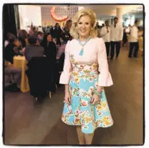  ??  ?? Fine Arts Museums board President Dede Wilsey flourishes in a dress from the final collection of the late Oscar de la Renta.