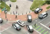  ?? JOHN WILLIARD ?? Police vehicles arrive at the scene of a June 2023 shooting in Richmond following a high school graduation near Virginia Commonweal­th University.