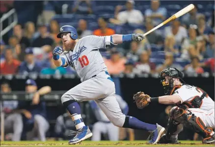  ?? Michael Reaves Getty Images ?? PLAYING ONLY HIS THIRD game of the season, Justin Turner provided a big spark to the struggling Dodgers offense by driving in five runs with a three-run double in the third inning and a two-run double in the fourth, above.