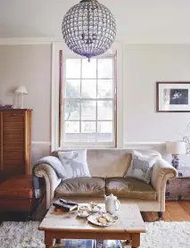  ??  ?? sitting room Inviting sofas, plump cushions and a deep-pile shaggy rug make for a cosy family space. antique panel mirror, £780sq m, Looking glass of bath. Majella globe crystal chandelier, £118, the Chandelier and Mirror Company, is similar