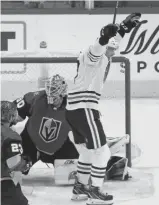  ?? JEFF VINNICK/GETTY IMAGES ?? Hawks forward Dylan Strome celebrates his goal at 19:46 of the second period that tied the game and set up an overtime finish.