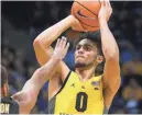  ?? WOOD / MILWAUKEE JOURNAL SENTINEL RICK ?? Marquette guard Markus Howard is averaging 17.5 points per game.