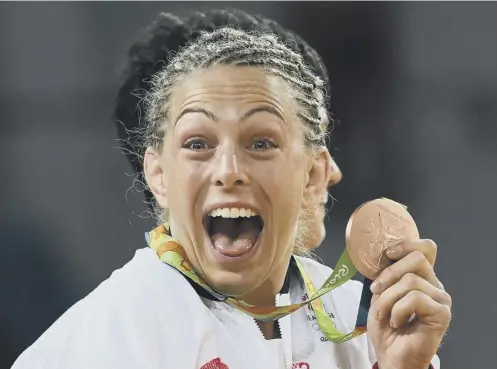  ??  ?? 0 Sally Conway celebrates her Olympic bronze medal in the -70kg judo contest at the 2016 Games in Rio.