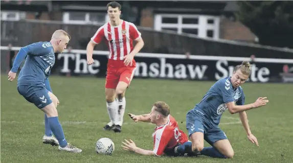  ?? ?? Ryhope CW, in red and white, close out Wolviston at Ryhope Recreation Park, on Saturday – Ryhope won the Durham Challenge Cup clash 7-0.