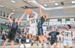  ?? Tim Godbee ?? Calhoun senior Tonocito Martha goes up for the shot against the Ringgold Tigers.