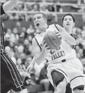  ?? John Heller/Post-Gazette ?? Chartiers Valley’s Matty McConnell drives through Montour defense in the second quarter Friday. McConnell scored a game-high 32 points against the Spartans.