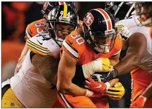  ?? AP/JACK DEMPSEY ?? Denver Broncos running back Phillip Lindsay (30), hit by Pittsburgh Steelers defensive end Tyson Alualu (94), rushed for 110 yards on 14 carries in a 24-17 victory Sunday.