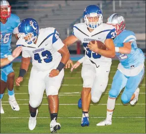  ?? Special to the Democrat-Gazette/MARK STALLINGS ?? Cary McClain (33) of Conway follows the blocking of Nick Tufu (43) on his way to a first down during the first half Friday against Fort Smith Southside in Fort Smith. Conway won 45-19.