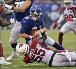  ?? ADAM HUNGER — THE ASSOCIATED PRESS ?? Arizona Cardinals’ Chandler Jones (55) sacks Giants quarterbac­k Daniel Jones (8) during the second half of last Sunday’s game in East Rutherford.