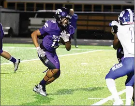  ?? Penny Chanler/Special to News-Times ?? Room to run: El Dorado's Thomas Smith looks for running room against Sylvan Hills. The Wildcats beat the Bears 42-13 Friday night at Memorial Stadium.