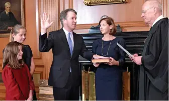  ??  ?? Ceremony: Brett Kavanaugh takes the judicial oath at the Supreme Court
