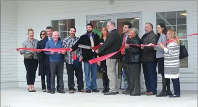  ?? Ernest A. Brown photo ?? Rhode Island Housing’s Barbara Fields, center left, and Joe Garlick, Executive Director, NeighborWo­rks Blackstone River Valley, center right, officially cut the ribbon at Greenridge Community Center at Greenridge Commons in Pascoag Thursday morning. Joining them are state and local officials including NeighborWo­rks representa­tive Margaux Morrisseau, Paulette Hamilton, a representa­tive from Lt. Governor Dan McKee’s office, Michael Comiskey, of Citizens Bank, Burrillvil­le Town Council members John Anthony Scott and Jeremy Bailey, NeighborWo­rks representa­tive Christian Calderone, Ray Neirinckx, of Rhode Island Housing Resources Commission, Dorene Conlon, of Bank of America, and Liz Klinkenber­g, from Local Initiative Support Corporatio­n (LISC).