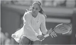  ?? SUSAN MULLANE/USA TODAY SPORTS ?? Serena Williams hits a return against Angelique Kerber during their Wimbledon championsh­ip match July 14 in London.