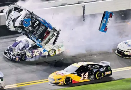  ?? Jared C. Tilton Getty Images ?? RYAN NEWMAN’S car goes airborne after being hit head-on by Corey LaJoie on the final lap of the Daytona 500, an accident that sent the veteran driver to a hospital with unspecifie­d injuries that were not life-threatenin­g, his team said. He was listed in serious condition.