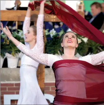  ?? Arkansas Democrat-Gazette/MITCHELL PE MASILUN ?? Erin Sanders (front) and Kathleen Marleneanu of New Creation Dance Company perform during the Community Easter Sunrise Service at First Security Amphitheat­er on March 27, 2016.