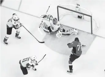  ??  ?? Washington Capitals right wing TJ Oshie (right) scores a goal on Vegas Golden Knights goaltender Marc-Andre Fleury in the first period in Game 4 of the 2018 Stanley Cup Finals at Capital One Arena in Washington DC on Monday. — Reuters