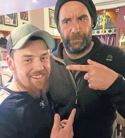  ??  ?? ACTOR: A delighted James Anderson, left, with Rory McCann in the Marlex bar, Lerwick, on Friday night