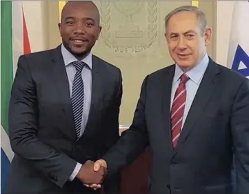  ??  ?? Mmusi Maimane shakes hands with Prime Minister of Israel Benjamin Netanyahu.