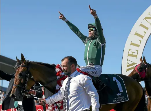 ?? GETTY IMAGES ?? Jason Waddell celebrates as he returns to scale aboard Jennifer Eccles after winning the Al Basti Equiworld Dubai New Zealand Oaks during the Al Basti Equiworld NZ Oaks day at Trentham Racecourse on Saturday.