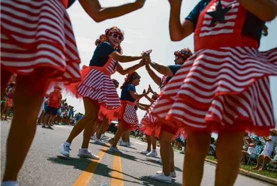  ?? MADELINE GRAY/NEW YORK TIMES ?? The Bodacious Belles of Beaufort, dancing above in the July Fourth parade in Beaufort, N.C., are a women’s support group.