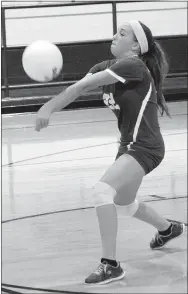  ?? Photo by Mike Eckels ?? Decatur’s Sofia Killebrew returns the ball back over the net to Prairie Grove at Peterson Gym in Decatur on Sept. 14.