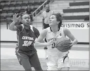  ?? NWA Democrat-Gazette/CHARLIE KAIJO ?? Bentonvill­e guard Avery Hughes (right) looks to put up a shot in front of Little Rock Central guard Jordan Greenwood on Friday during Bentonvill­e’s 65-35 victory at the Class 6A state tournament in Centerton.