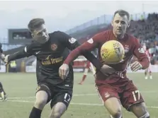  ??  ?? 0 Winger Gary Mackay-steven drills Aberdeen into a 4-1 lead. Inset, the Dons’ No 9 Adam Rooney is congratula­ted on scoring the opener. Left, Niall Mcginn tussles with Dundee United’s Jamie Robson.