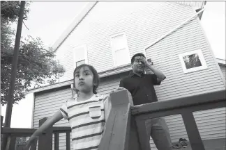  ??  ?? Jesus Manuel Lara Lopez and his daughter Elsiy, 6, are shown May 15 at home in Willard, Ohio, where he works a graveyard packing shift for Pepperidge Farm. Lara, who came here illegally from Mexico 16 years ago, is due for deportatio­n on July 18, despite multiple letters of support; his original deportatio­n order stems from driving without a license.